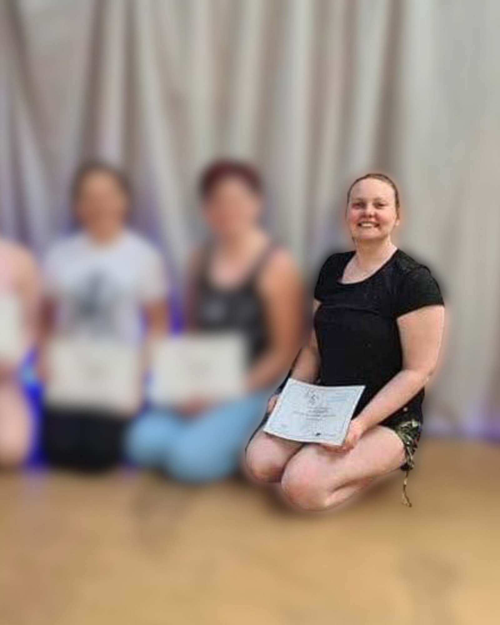 Ciara with pole dance students holding their certificates